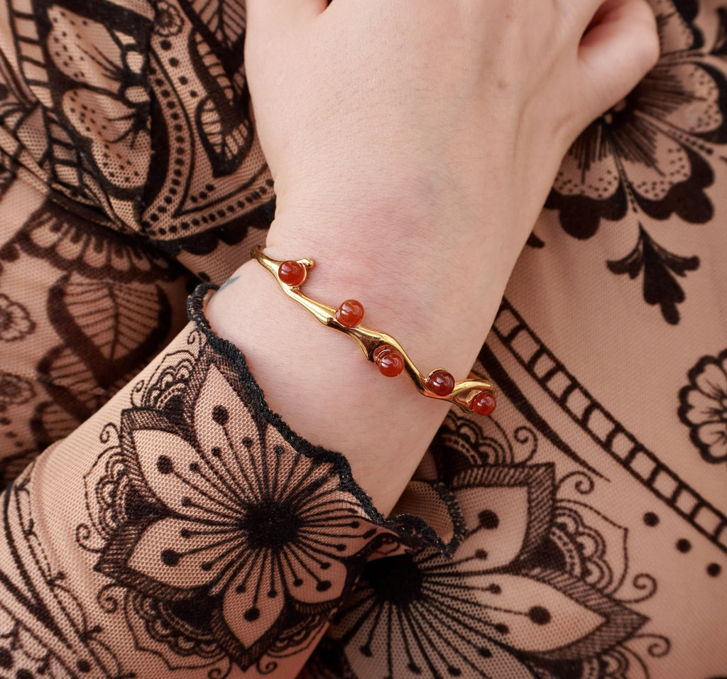 Astra bracelet by Mareas featuring deep red stones