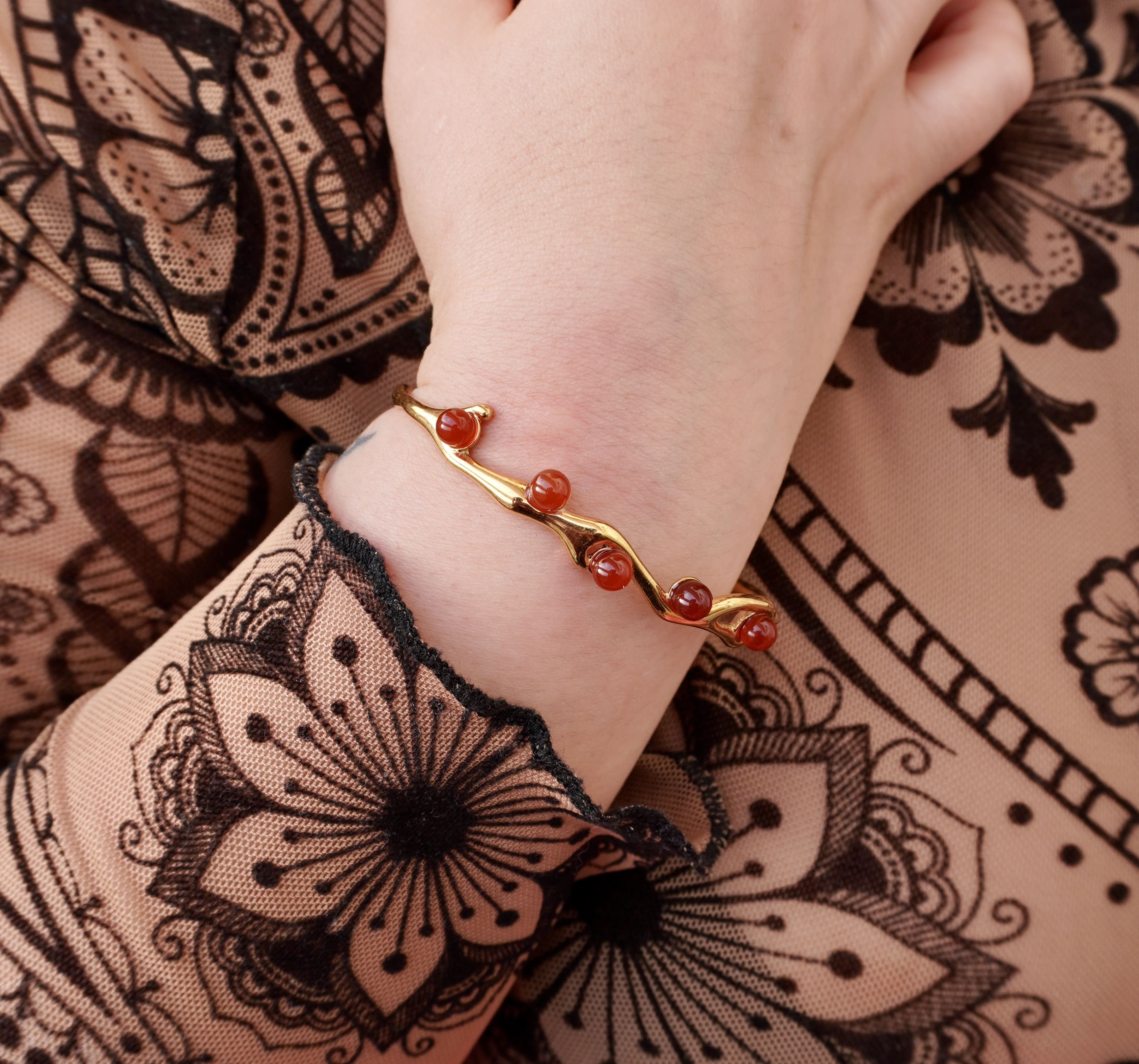 Astra bracelet by Mareas featuring deep red stones
