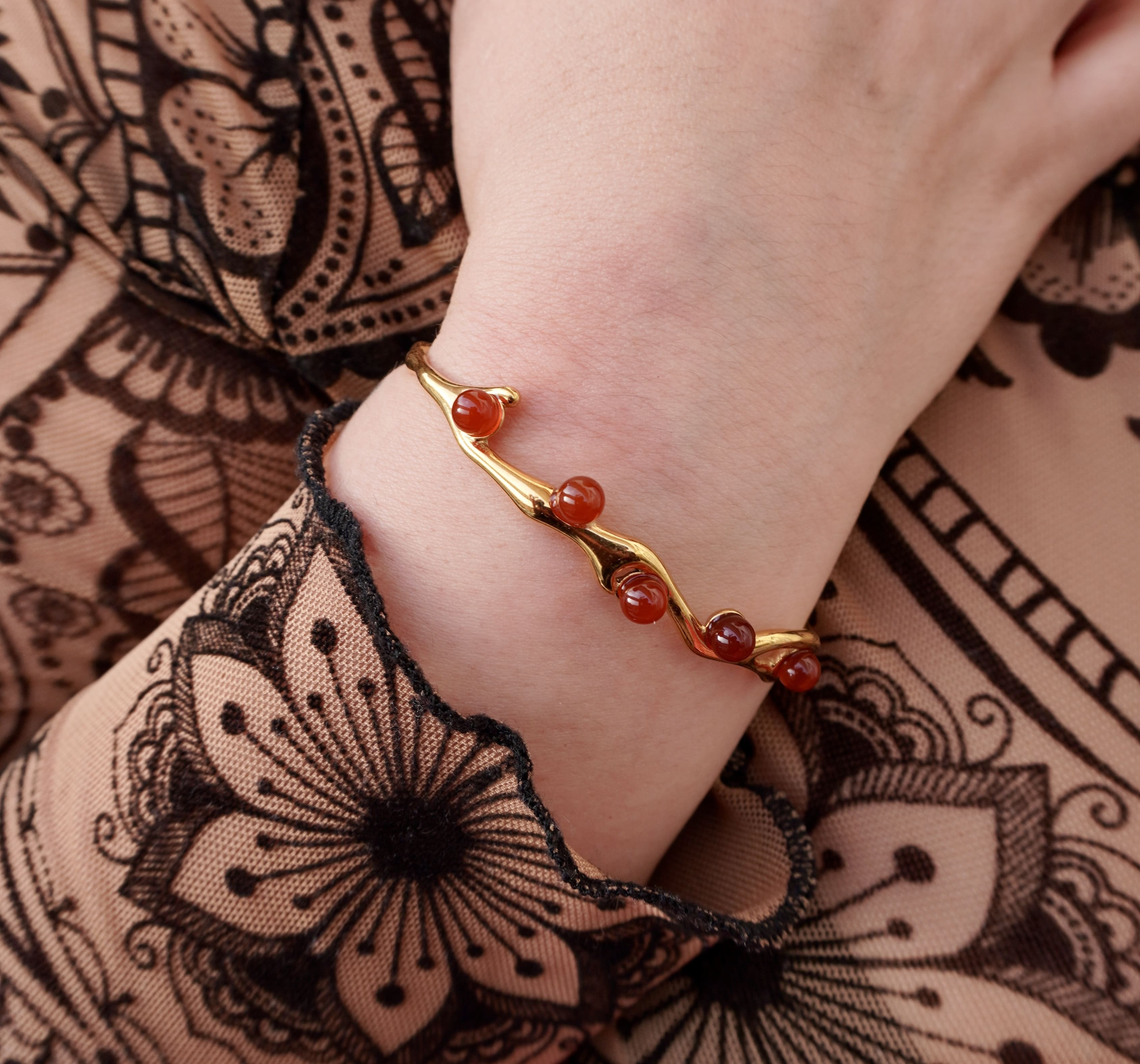 Astra bracelet by Mareas featuring deep red stones
